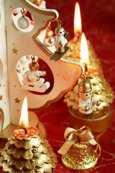 Christmas detail with small Christmas tree and candles