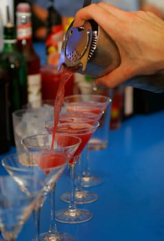 Drinks being poured at a bar