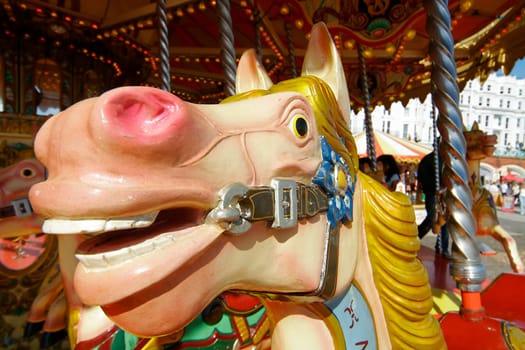 A close up of a carousel horse