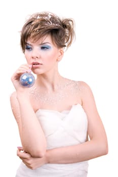snow girl holding a christmas toy in her hand