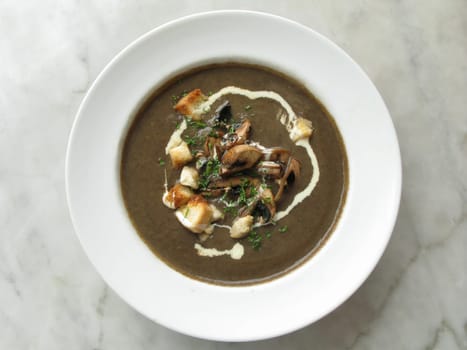 top shot photo of mushroom soup on marble table