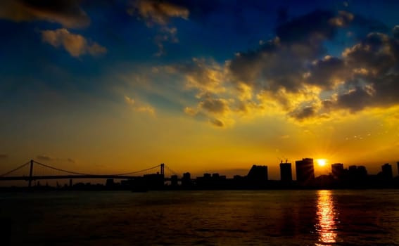 Sunset across Tokyo bay and the rainbow bridge