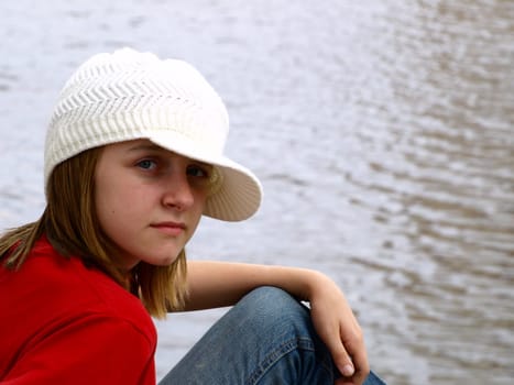 Young adolescent girl in crochet hat
