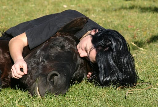 riding young woman and her best friend black stallion