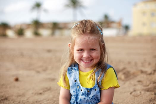 Beautiful small girl is smiling sincerely