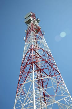 communications tower with a blue sky behind