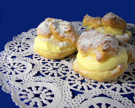 Rich dessert on white lace doily.