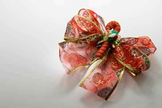 close up photo of red christmas ribbon as decoration