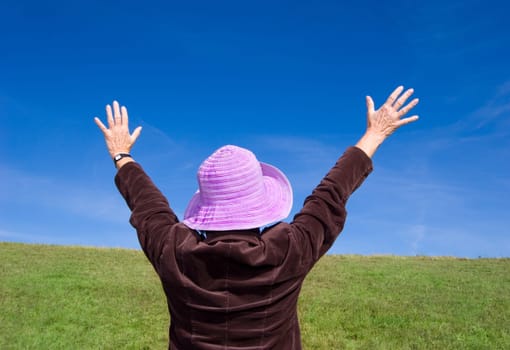 Attractive mature woman enjoying life on the meadow :-)
