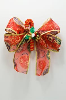 close up photo of red christmas ribbon as decoration