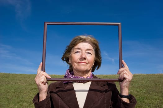 Attractive mature woman enjoying life on the meadow :-)