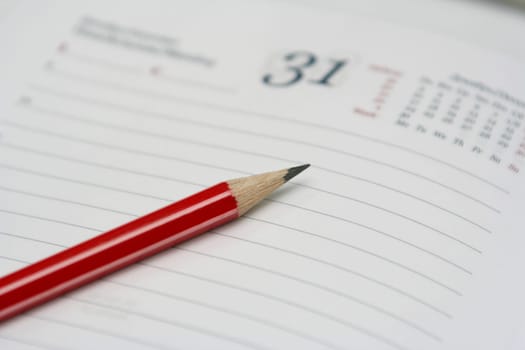 The sharp pencil lays on a notebook