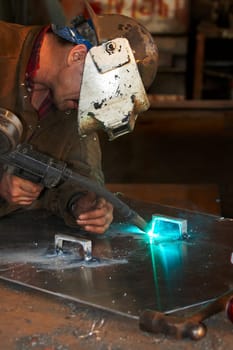 welder at shipyard working