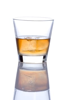 Glass of alcohol shot against white background