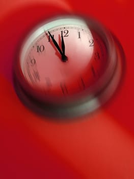Blurred clock about to strike midnight