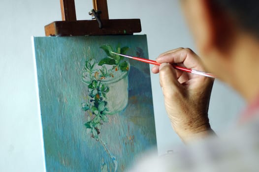 Artist painting in progress.