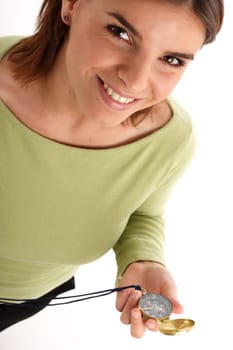 Happy young woman holding compass