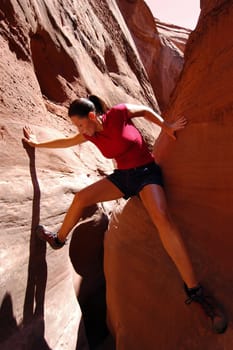 Active woman canyoneering in Utah