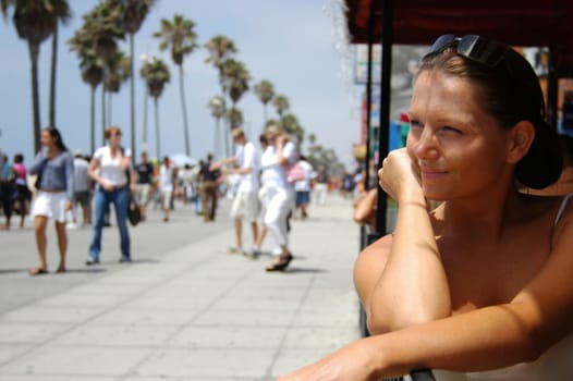 Woman on roadside cafe in Venice Beach, Los Angeles