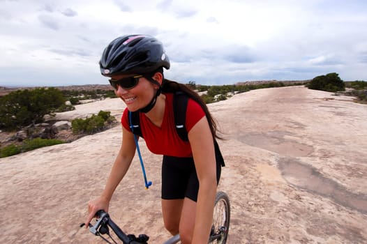 Smiling woman on mountain bike