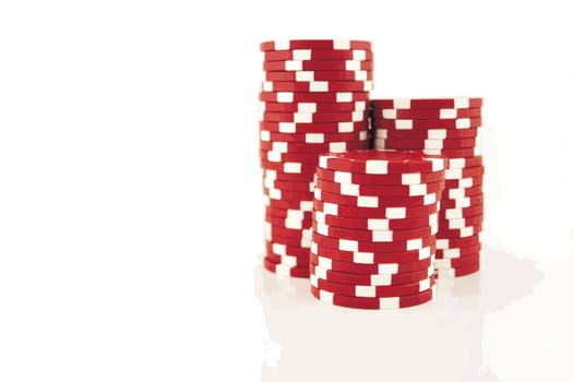 3 part stacks of red casino chips isolated on a white background