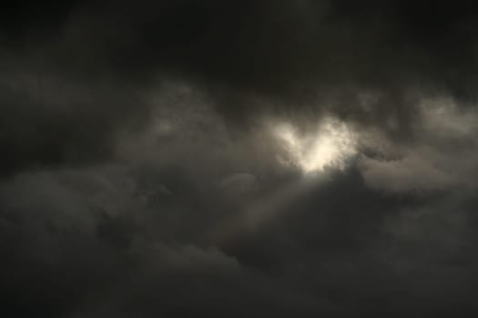 Expectation of something good. Dark clouds and sun beam. Can stand and look couple hours and believe that soon will see sun shining, clear blue skies.