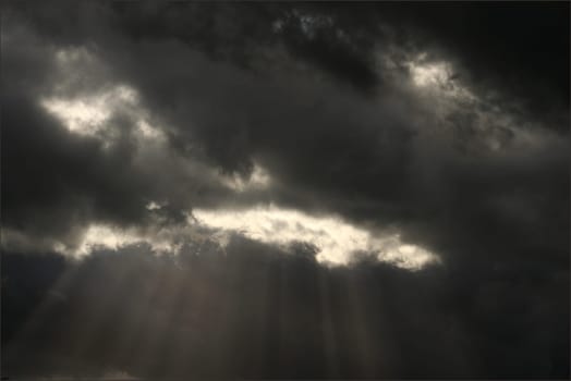 Expectation of something good. Dark clouds and sun beam. Can stand and look couple hours and believe that soon will see sun shining, clear blue skies.