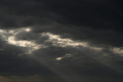 Expectation of something good. Dark clouds and sun beam. Can stand and look couple hours and believe that soon will see sun shining, clear blue skies.