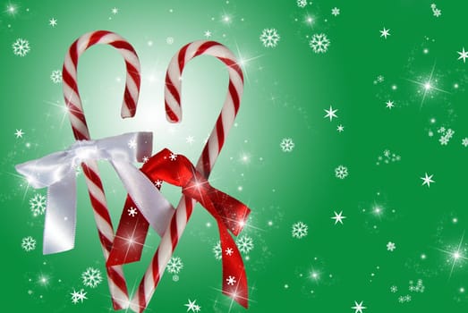 Pair of candy canes formed into a heart on a festive background.