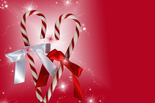 Pair of candy canes formed into a heart on a festive background.