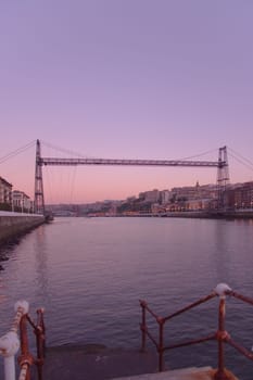 Suspension bridge of Bizkaia growing dark from getxo