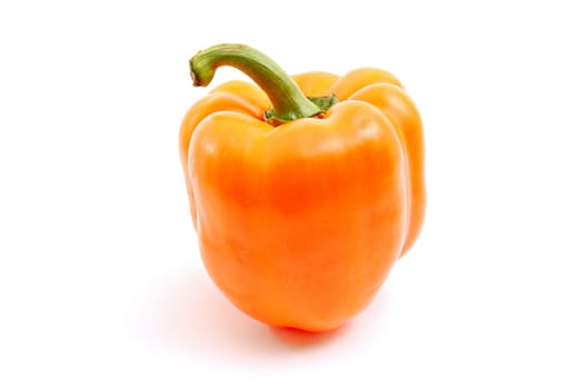 Simply atypical orange paprika on white background