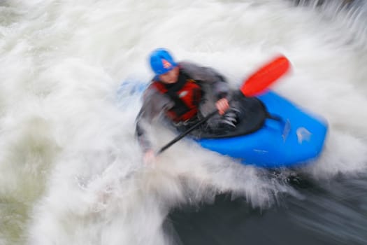 Motion blurred shot of whitewater kayaking