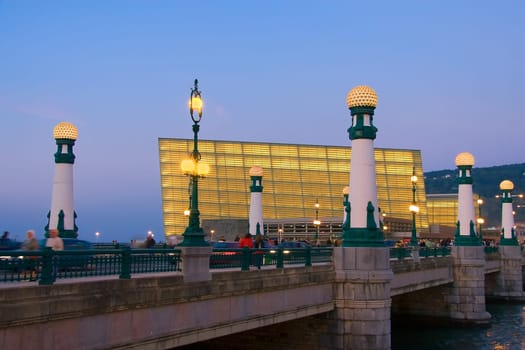 Bridge of Zurriola lit at dusk Donostia