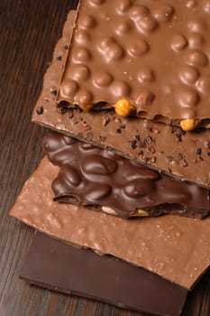 Slabs of assorted delightful chocolate goodness stacked on top of each other. Sweet!