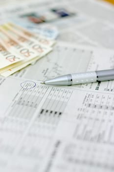 Money and a business newspaper