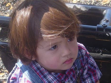 2 year old posing for the camera.