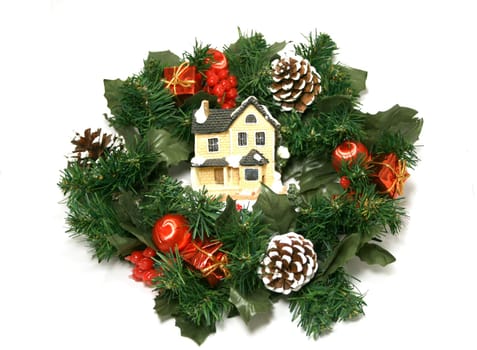 Garland with toy-house inside it as Christmas decoration