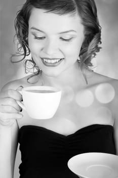 glamorous girl having a cup of coffee