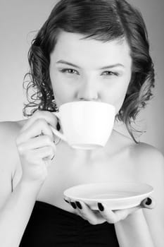 glamorous girl having a cup of coffee