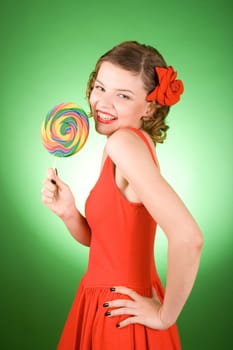 girl in red with a rainbow lollipop