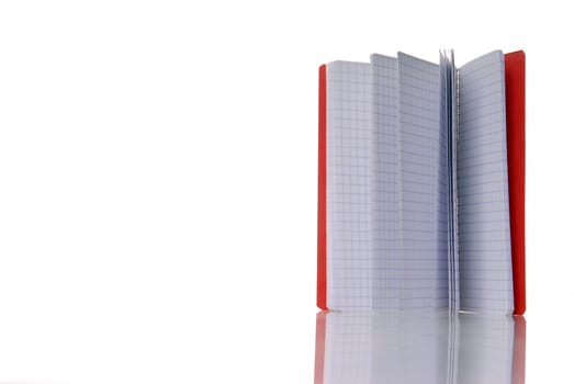 red notebook isolated over white. With reflection