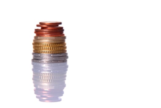 Stack of euro coins isolated over white background, with reflection