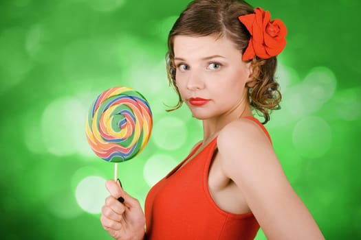 girl in red with a rainbow lollipop