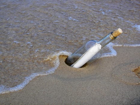 Message in a bottle on the shore.