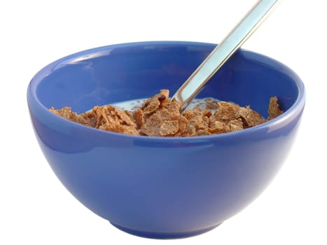 A blue bowl of breakfast cereal and milk