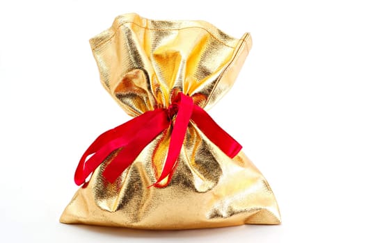 A gift in golden bag with red bow