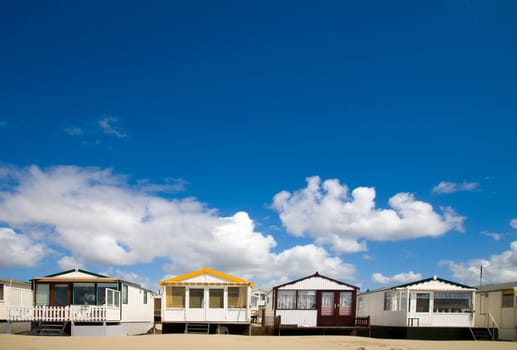 Beachs huts in a row by IJmuiden, the Netherlands