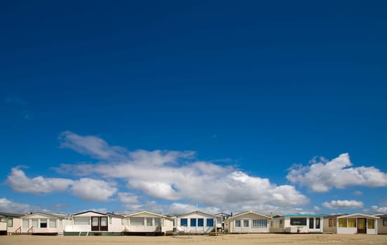 Beachs huts in a row by IJmuiden, the Netherlands