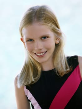 Happy smiling blond girl with blue eyes